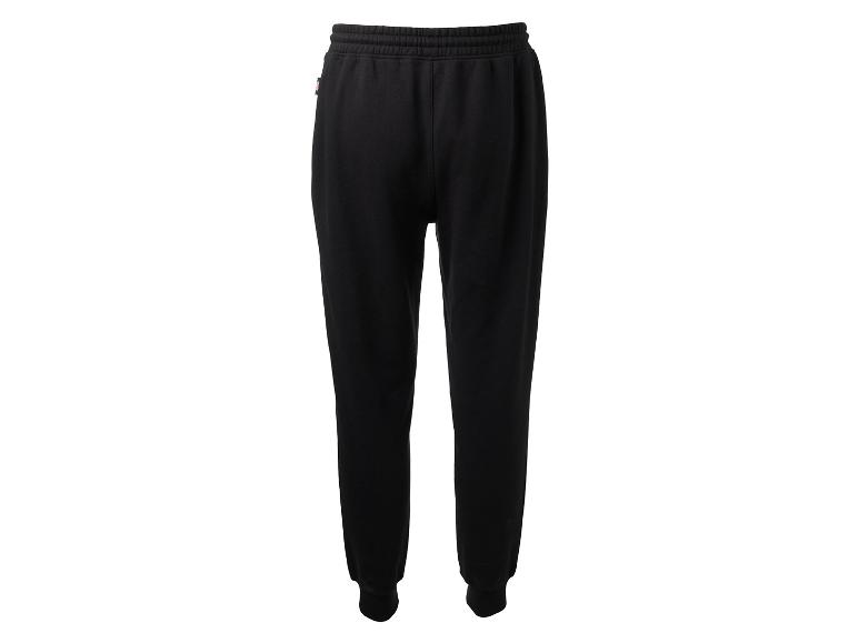 Pantalon de survêtement noir avec taille et chevilles élastiques.