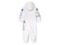 Une combinaison blanche pour enfants sur le thème de l'espace, avec des images de fusées et de la NASA.