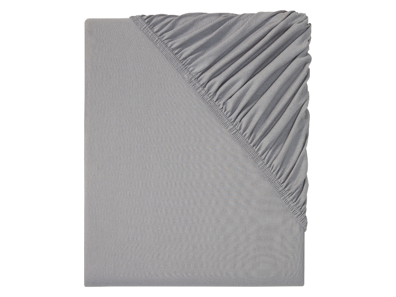Drap-housse et drap plat gris : literie simple et confortable.