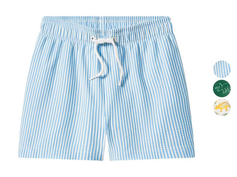 Short de bain rayé bleu et blanc avec cordon, avec options de motifs dinosaures.