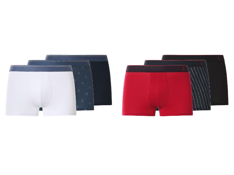 Six paires de boxers pour hommes en blanc, bleu, rouge et noir, certains avec des motifs.