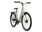 Un vélo électrique beige avec des pneus Schwalbe.