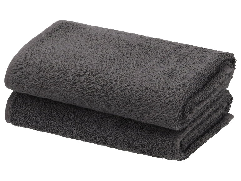 Deux serviettes de bain grises empilées.