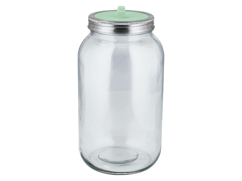 Bocal en verre transparent avec couvercle métallique et insert vert pour la germination.