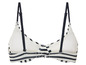 Un haut de bikini blanc à rayures noires.