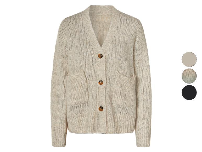 Gilet beige en tricot avec poches.
