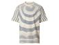 T-shirt rayé texturé à manches courtes en blanc et bleu.