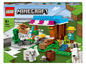 Ensemble LEGO Minecraft avec une boulangerie, un creeper, un fermier et des chèvres.