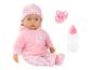 Poupée bébé en vêtements roses à cœurs, avec sucette et biberon.