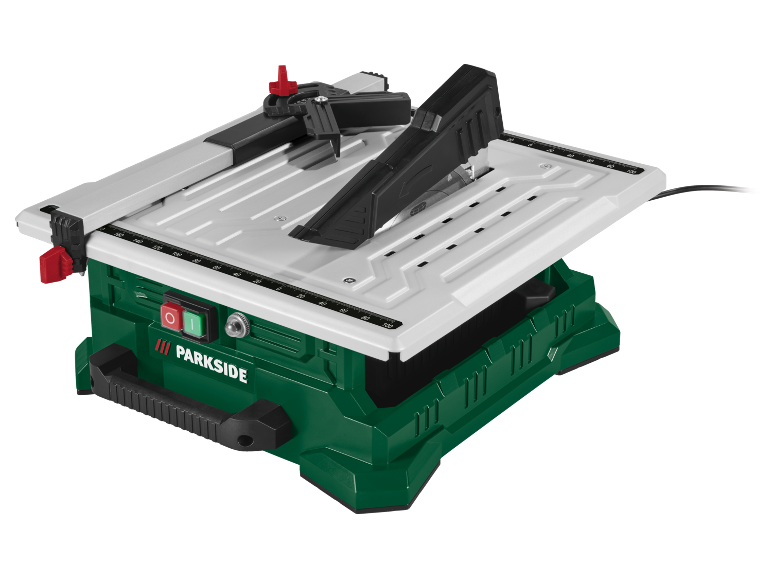 Une scie de table compacte, verte et blanche, avec une lame visible et un guide.