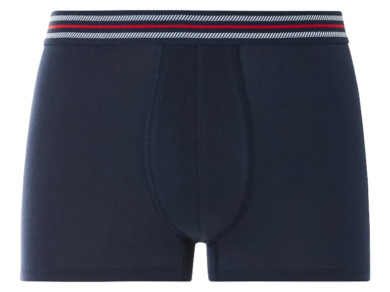 Boxers bleus marine avec des rayures rouges et blanches.