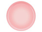 Une assiette en céramique rose.