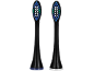 Deux têtes de brosse à dents électriques noires avec des poils bleus, blancs et verts.