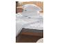 Oreillers et couette Hydrocool sur un lit.