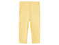 Leggings en tricot jaune pour bébés.