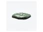 Une goutte de peinture verte sur une surface blanche.