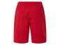Short rouge avec élastique à la taille.