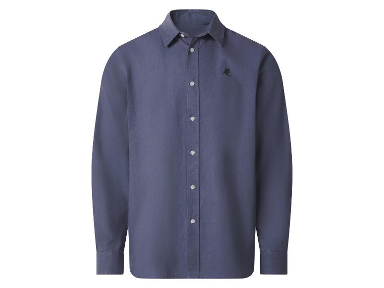 Chemise à manches longues bleu foncé avec boutons blancs et petit logo brodé sur la poitrine.