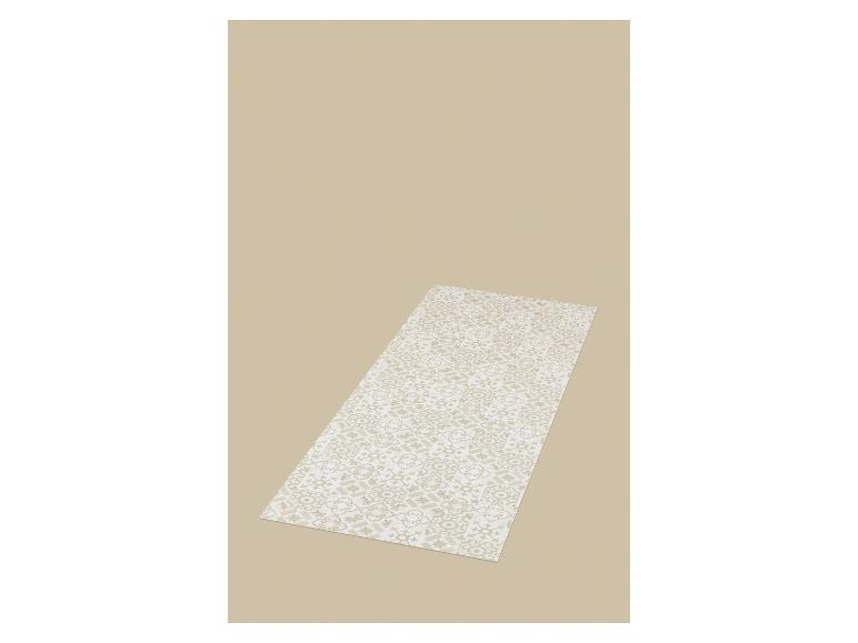 Un tapis de yoga beige avec un motif géométrique blanc et marron clair.