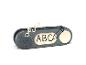 Un bouton gris avec les lettres ABC, un microphone et une icône de crayon