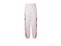 Pantalon de survêtement blanc avec détails orange et noirs.