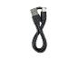 Câble de charge USB-A vers USB-C noir en forme de huit sur fond blanc.