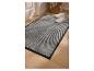 Paillasson LIVARNO home gris avec des baskets blanches