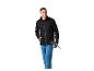Homme en veste noire et pantalon bleu tenant des bâtons de randonnée.