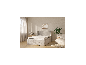 Matelas à ressorts ensachés LIVARNO HOME sur un lit rembourré dans une chambre moderne.