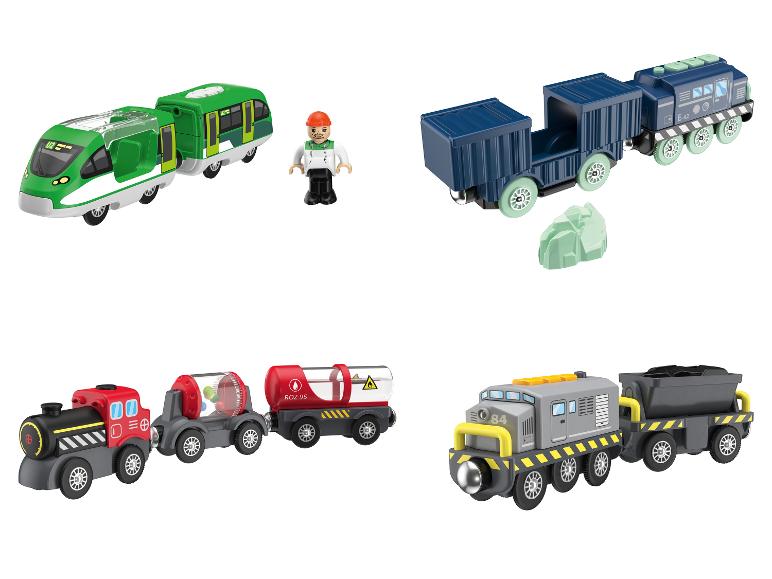 Ensemble de trains jouets avec locomotives, wagons et une figurine.