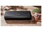 Appareil de mise sous vide SilverCrest sur une table en bois, avec ail et romarin.