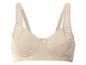 Soutien-gorge beige avec détails en dentelle sur les bretelles et un petit nœud central.