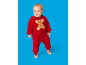 Bébé en ensemble de Noël rouge et duveteux avec un bonhomme de pain d'épices