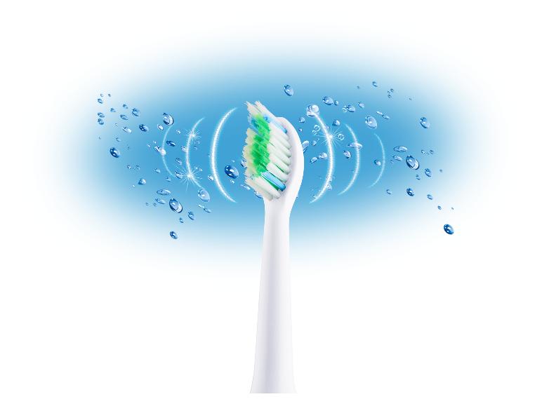 Brosse à dents électrique avec une tête blanche et des poils verts et bleus, entourée de gouttelettes d'eau.