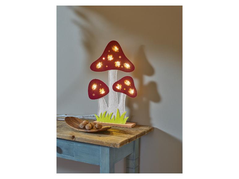 Lampe en bois en forme de champignons avec lumières LED, sur une table.