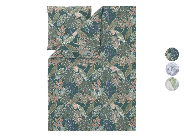 Parure de lit avec motif feuilles tropicales dans les tons verts et marrons.