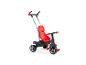 Un tricycle rouge avec une barre de poussée de la marque MOOV.