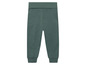 Pantalon de survêtement vert pour enfants.