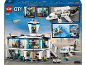 Boîte de jeu de construction d'aéroport avec terminal, avion et figurines.