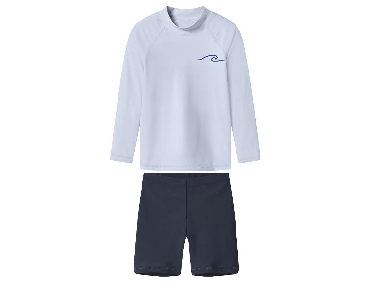 Ensemble de bain enfant avec un haut blanc à manches longues orné d'une vague bleue et un short bleu marine.