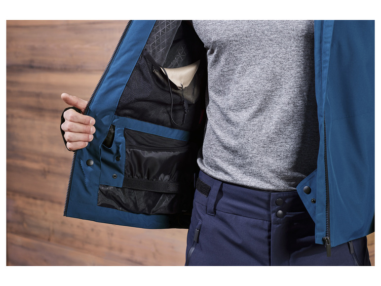 Une veste bleue avec une doublure en mesh et plusieurs poches