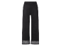 Pantalon large noir avec ourlets transparents.