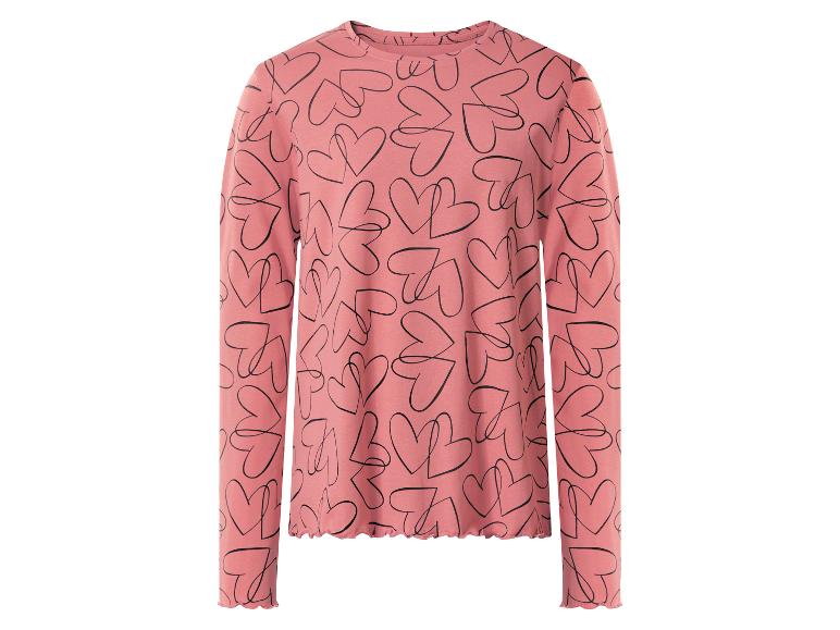 Haut rose à manches longues avec imprimé cœurs noirs.
