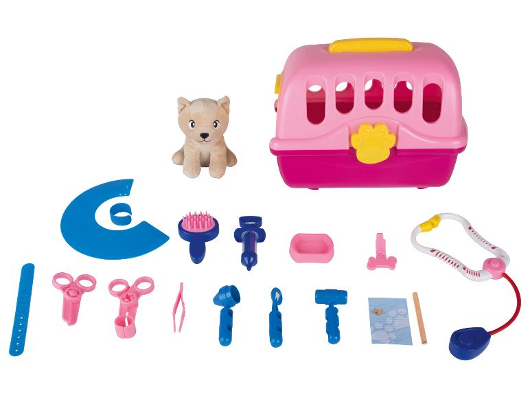 Jouet vétérinaire avec chien en peluche, cage de transport et accessoires.