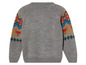 Pull gris avec motif de renards et de fleurs sur les manches.