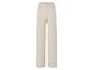 Pantalon large beige avec taille élastique.