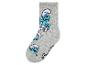 Des chaussettes grises avec un motif de Schtroumpfs.