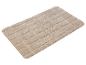 Tapis de bain beige à carreaux.