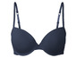 Un soutien-gorge bleu foncé avec des bonnets lisses et des bretelles réglables.