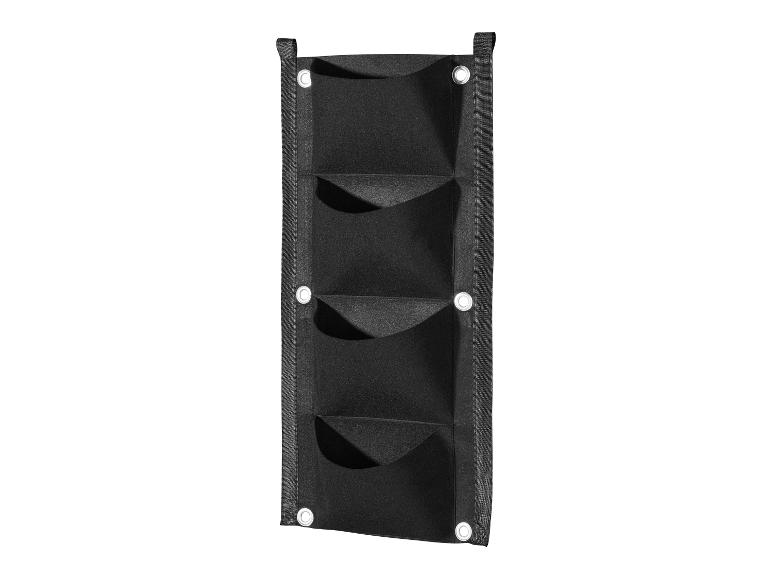 Un sac de plantation mural noir pour plantes.